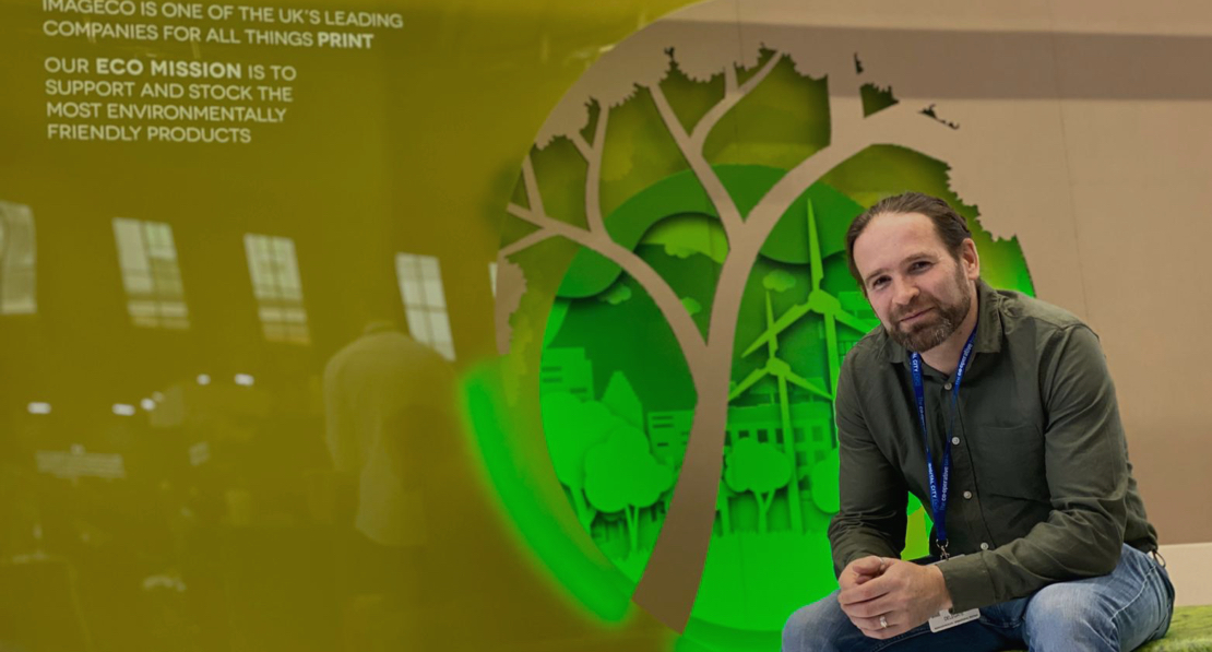 Picture of Nathan, Managing Director of Imageco at Digital City exhibition stand made from cardboard